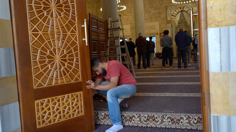 Repair work at the Emir Mansour Assaf mosque continues while it receives worshipers. The National