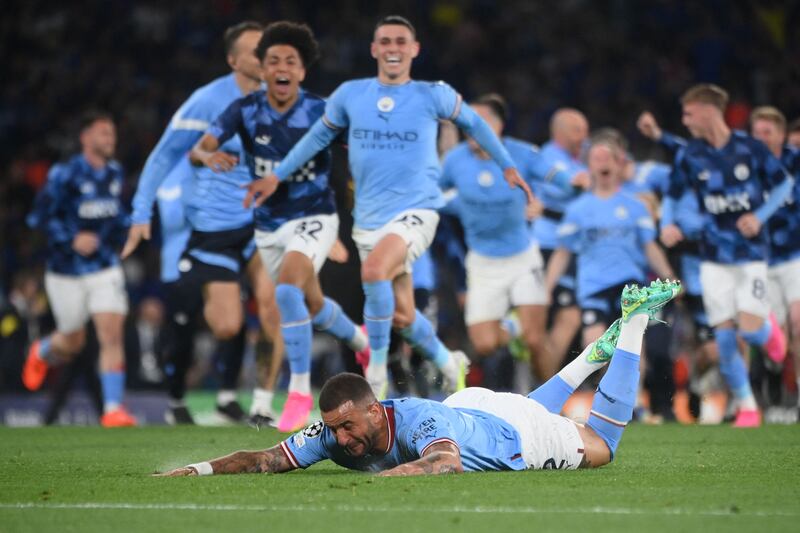 Manchester City's English defender #2 Kyle Walker slides as he celebrates winning the UEFA Champions League final football match between Inter Milan and Manchester City at the Ataturk Olympic Stadium in Istanbul. AFP