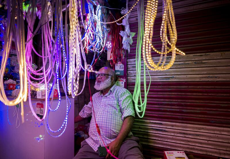 A vendor sells decorative lights ahead of Diwali in New Delhi.  Indian shoppers are back in force online and in stores, splurging this festive season. Bloomberg