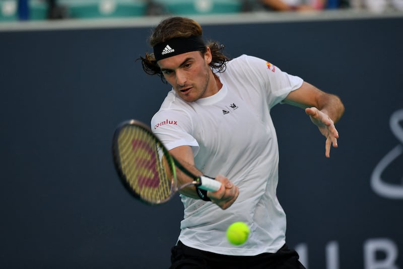 Stefanos Tsitsipas hits a forehand to Cameron Norrie during their quarter-final match at the Mubadala World Tennis Championship at the International Tennis Centre in Abu Dhabi on December 16, 2022. AFP