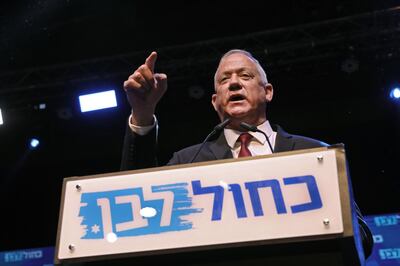 Benny Gantz, leader and candidate of the Israel Resilience party that is part of the Blue and White (Kahol Lavan) political alliance, addresses supporters at the alliance's campaign headquarters in the Israeli coastal city of Tel Aviv early on September 18, 2019. Israeli Prime Minister Benjamin Netanyahu and his main challenger Benny Gantz were locked in a tight race in the country's general election after polls closed, exit surveys showed, raising the possibility of another deadlock. Three separate exit polls carried by Israeli television stations showed Netanyahu's right-wing Likud and Gantz's centrist Blue and White alliance with between 31 and 34 parliament seats each out of 120. / AFP / GALI TIBBON
