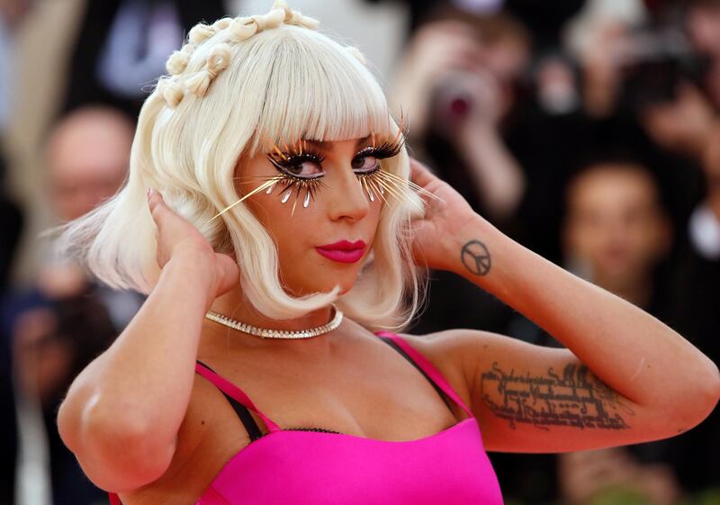 Exaggerated lashes were one of the night's key looks, and singer and actress Lady Gaga also jumped on the beauty bandwagon. Hers were crafted in shimmering gold, and off-set punchy pink lips and monochromatically lined eyes. Reuters