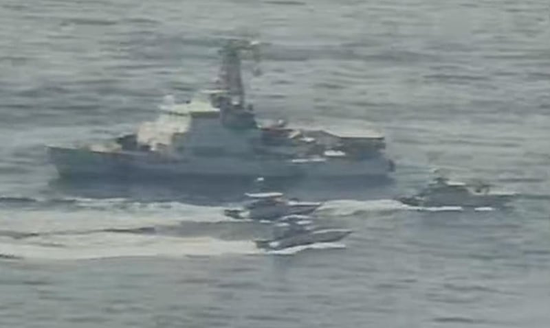 Iranian Islamic Revolutionary Guard Corps Navy (IRGCN) vessels near US Military ships at close range. EPA