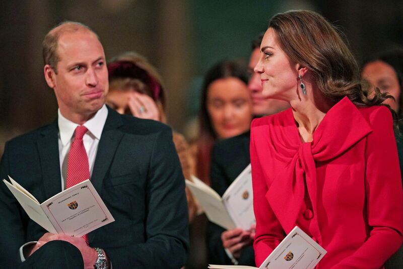 Britain's Prince William and Kate, the Duchess of Cambridge, attend the Christmas Eve carol service. AP/pool