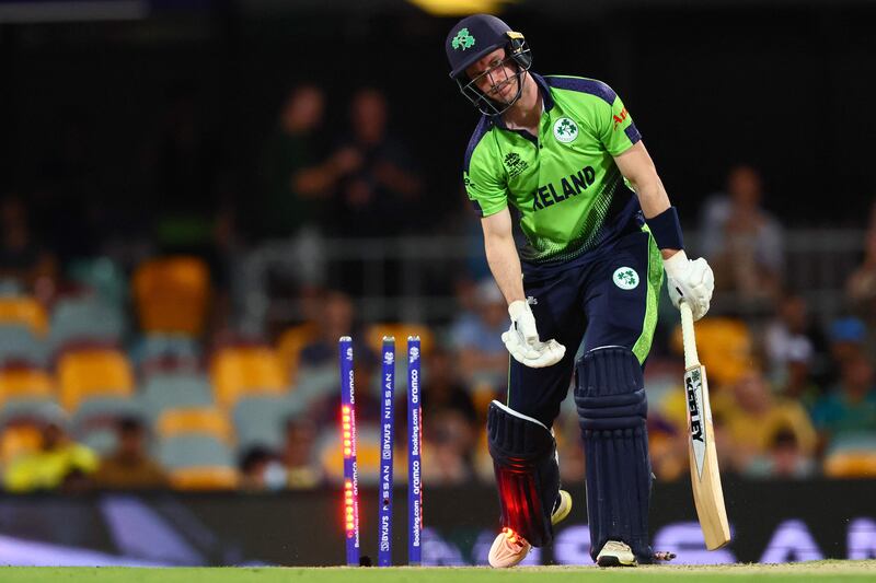 Ireland's George Dockrell is bowled by Australia's Mitchell Starc. AFP