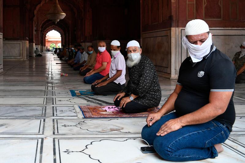 Muslim devotees offer prayers at the Jamma Masjid. AFP