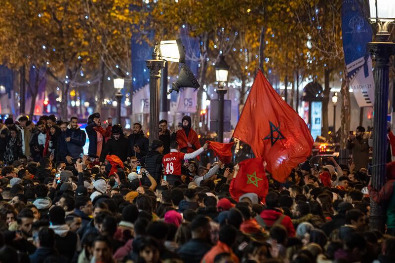 The Champs-Elysees in Paris rings with cheers from Moroccans. EPA