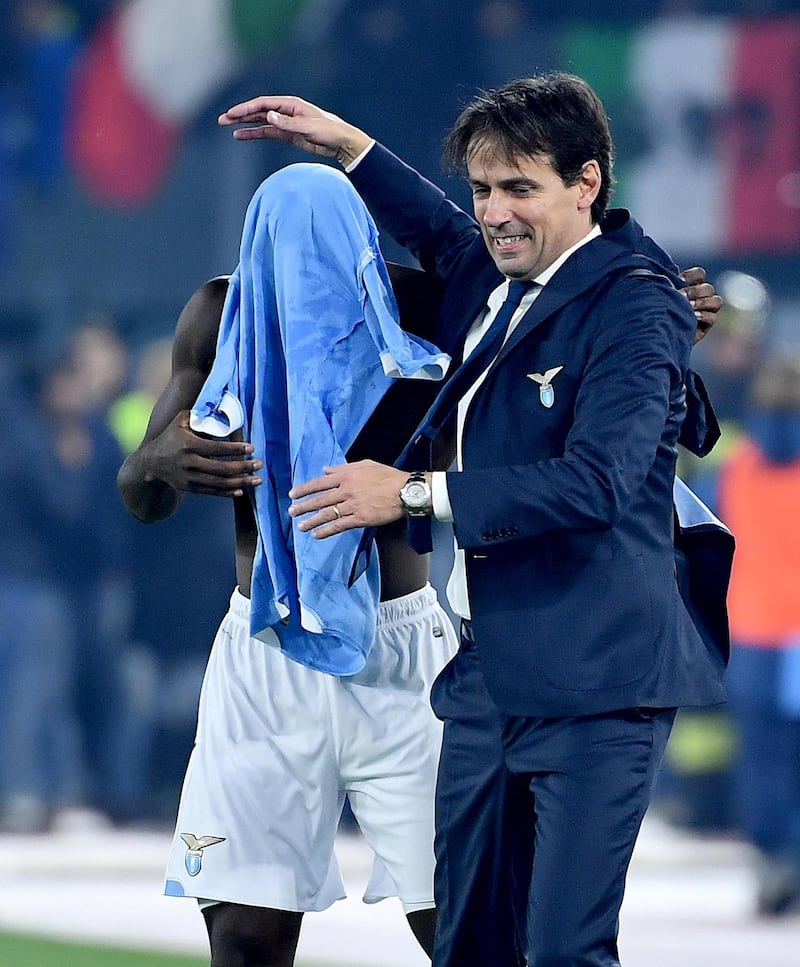 Lazio's Felipe Caicedo celebrates with his manager Simone Inzaghi after scoring to make it 3-1. EPA