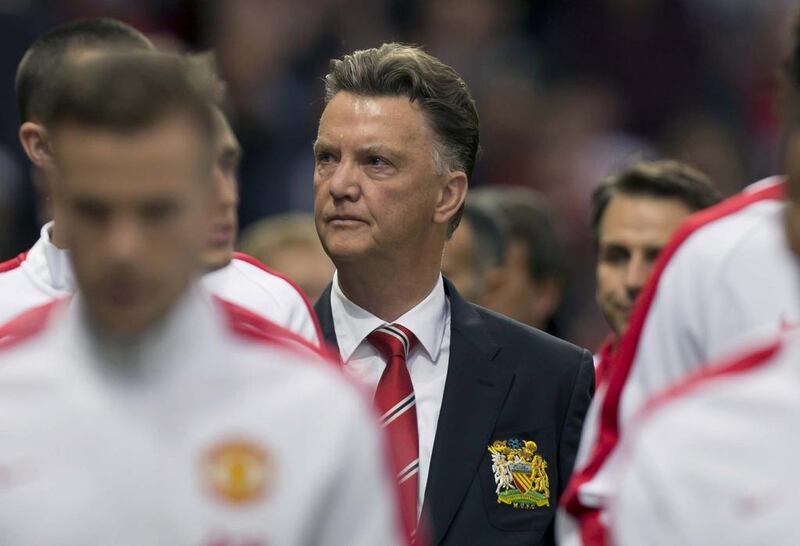 Manchester United's new manager Louis van Gaal, centre,  is repeating his plea for patience on the season. Jon Super / AP Photo