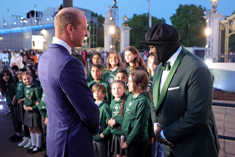 Britain's Prince William meets with singer Gregory Porter during the lighting of the principal beacon, as part of Queen Elizabeth II's platinum jubilee celebrations, at Buckingham Palace, in London, Britain June 2, 2022. Reuters
