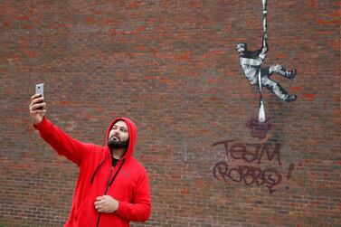 The vandalised mural that was painted by Banksy on a wall at HM Reading Prison. Reuters