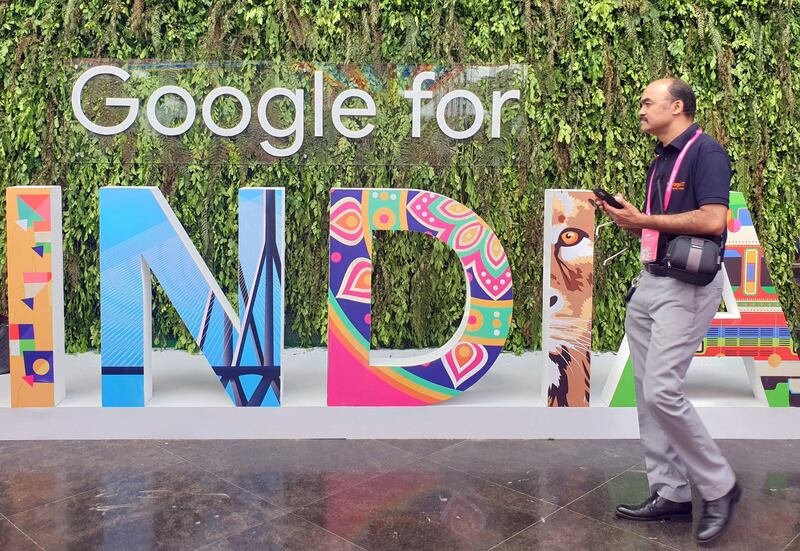 A man walks past a sign that reads 'Google for India'. Google Street View is now available in parts of the country. Reuters