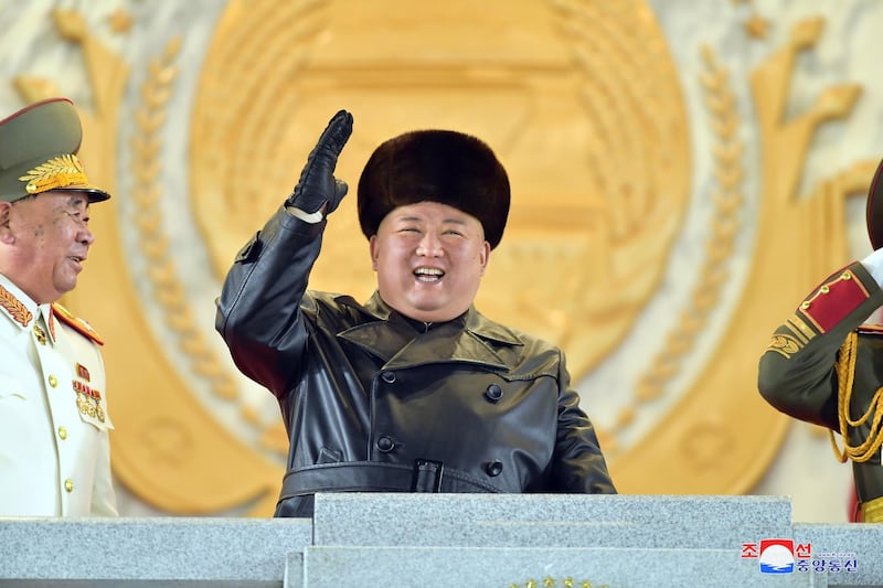 North Korean leader Kim Jong-un reacts during a military parade held to mark the 8th Congress of the Workers' Party of Korea in Pyongyang, North Korea. North Korean Central News Agency (KCNA) / EPA