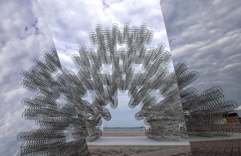 Abu Dhabi, United Arab Emirates, February 10, 2020.  The new stainless steel bicycle sculpture by Ai Wei Wei at the Corniche, Abu Dhabi gives a blurry effect because of the positioning by the artist on a cloudy morning.Victor Besa / The NationalSection:  ACReporter:  Ashleigh Stewart