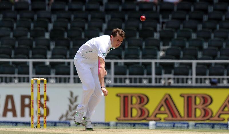 (FILES) In this file photo taken on December 18, 2013 South African bowler Dale Steyn bowls to Indian batsman Shikhar Dhawan on the 1st day of the cricket Test Match South Africa vs India at Wanderers Stadium in Johannesburg.   South African Dale Steyn, one of the great fast bowlers of the modern era, on August 5, 2019 announced his retirement from Test cricket in a bid to extend his longevity in the shorter forms of the game. / AFP / -
