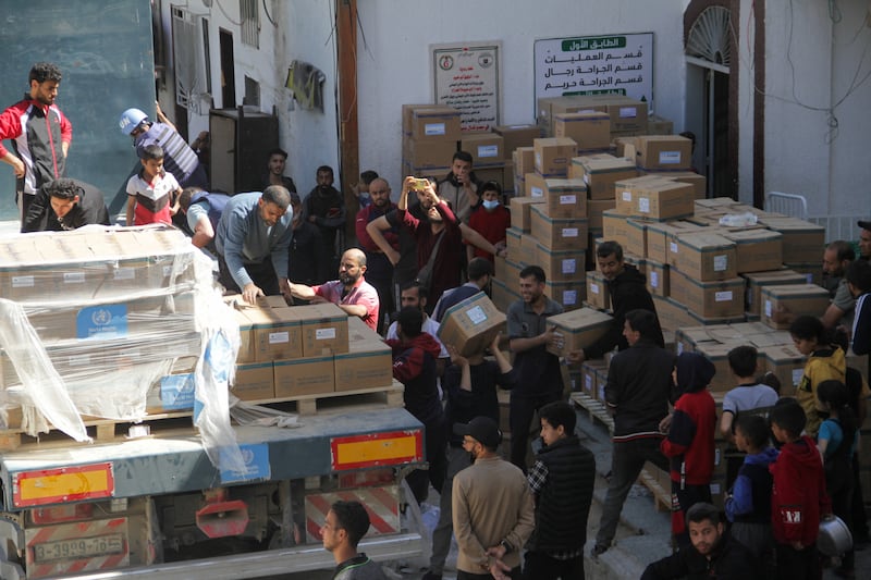 People unload medical aid from a lorry near Kamal Adwan Hospital in the northern Gaza Strip. Reuters