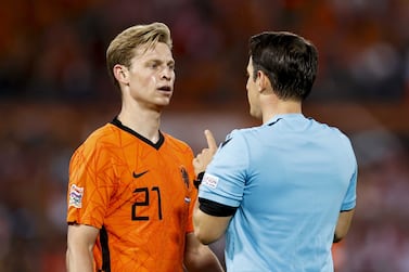 Frenkie de Jong (L) of Netherlands and referee Halil Umut Meler react during the UEFA Nations League soccer match between the Netherlands and Poland at Feyenoord stadium in Rotterdam, Netherlands, 11 June 2022.   EPA / MAURICE VAN STEEN