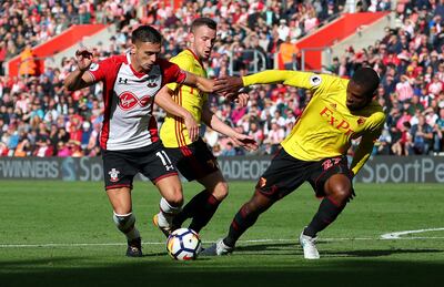 Soccer Football - Premier League - Southampton vs Watford - Southampton, Britain - September 9, 2017   Southampton's Dusan Tadic in action with Watford's Tom Cleverley and Christian Kabasele   REUTERS/Hannah McKay  EDITORIAL USE ONLY. No use with unauthorized audio, video, data, fixture lists, club/league logos or "live" services. Online in-match use limited to 75 images, no video emulation. No use in betting, games or single club/league/player publications. Please contact your account representative for further details.