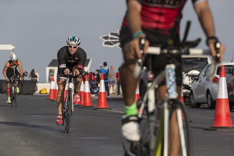 DUBAI, UNITED ARAB EMIRATES, 29 JANUARY 2016. The Ironman 70.3 Dubai Triathlon held on Sunset Beach next to the Burj Al Arab. General contestants take part in the cycle stage of the race. (Photo: Antonie Robertson/The National) ID: None. Journalist: None. Section: Sport.