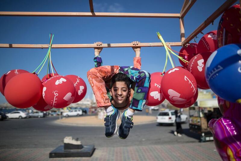 Palestinian boy Mohammed Al Sheikh, 12, shows his skills in Gaza city on April 28, 2016. Mohammed dreams of a Guinness world record for his almost unbelievable body contortions. Mahmud Hams/AFP