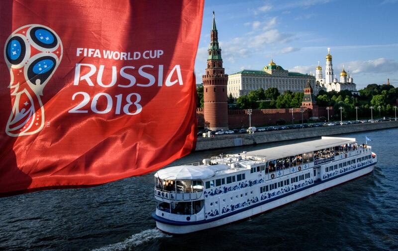 A photograph taken on May 30, 2018  shows the FIFA World Cup 2018 flag in front of the Kremlin in Moscow. The FIFA World Cup 2018 tournament kicks off on June 14, 2018. / AFP / Mladen ANTONOV
