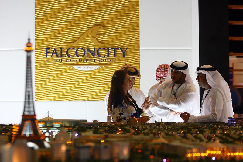 Dubai , United Arab Emirates- September 27,  2011:    Visitors browse the  Dubai Land's Falconcity  projects  at Cityscape Global in Dubai.  ( Satish Kumar / The National ) For Business