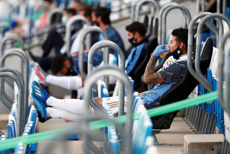 Real Madrid's James Rodriguez in the stands, as play resumed behind closed doors. Reuters