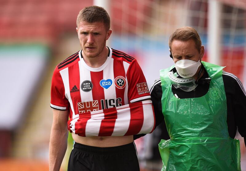 John Lundstram - 6: Snapped at Arsenal heels before departing to a nasty looking injury, EPA