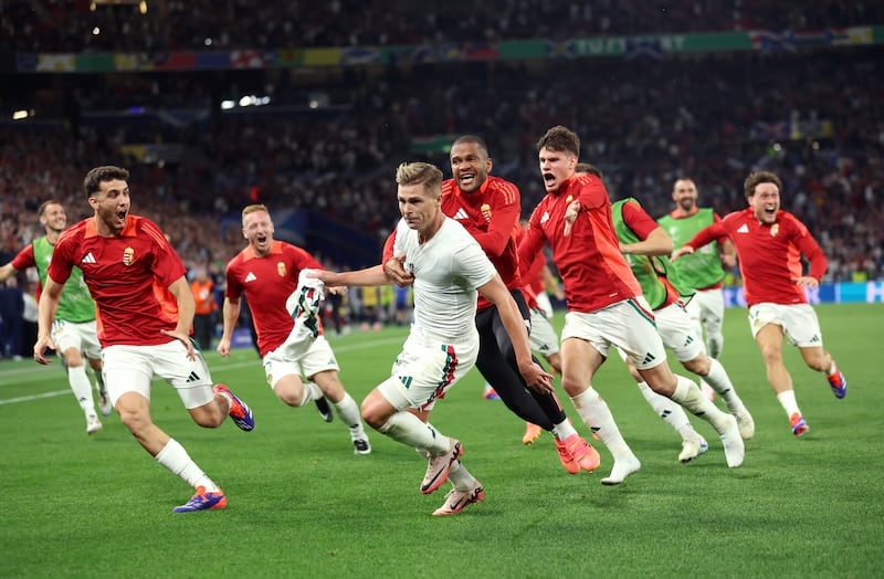 Kevin Csoboth of Hungary celebrates scoring his team's winner with teammates. Getty Images
