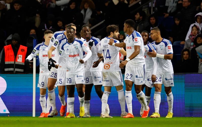Strasbourg players celebrate the own goal scored by Marquinhos. Reuters