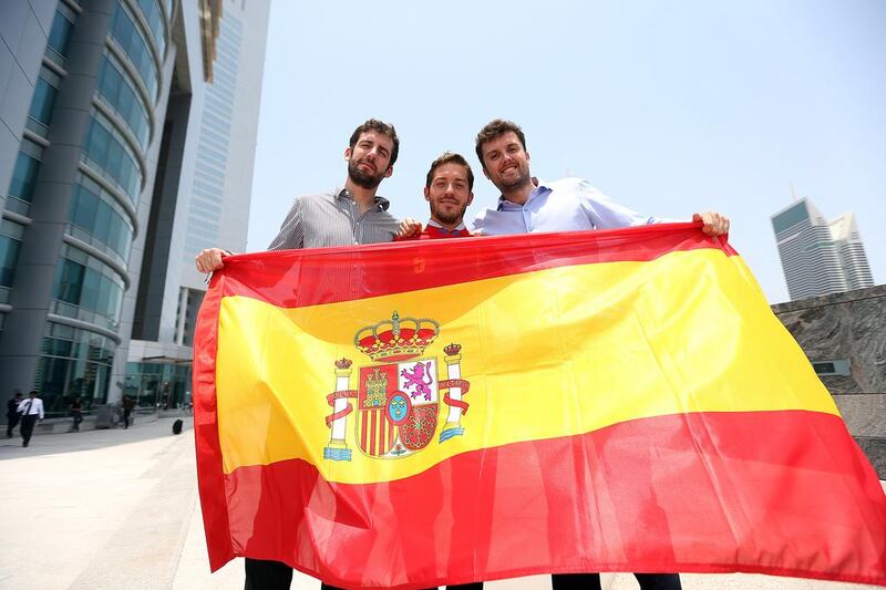 Local Spanish soccer fans  Nicholas Calonje, Carlos Sistiaga and Lucas Aylagas are all ready to cheer their side along. Satish Kumar / The National