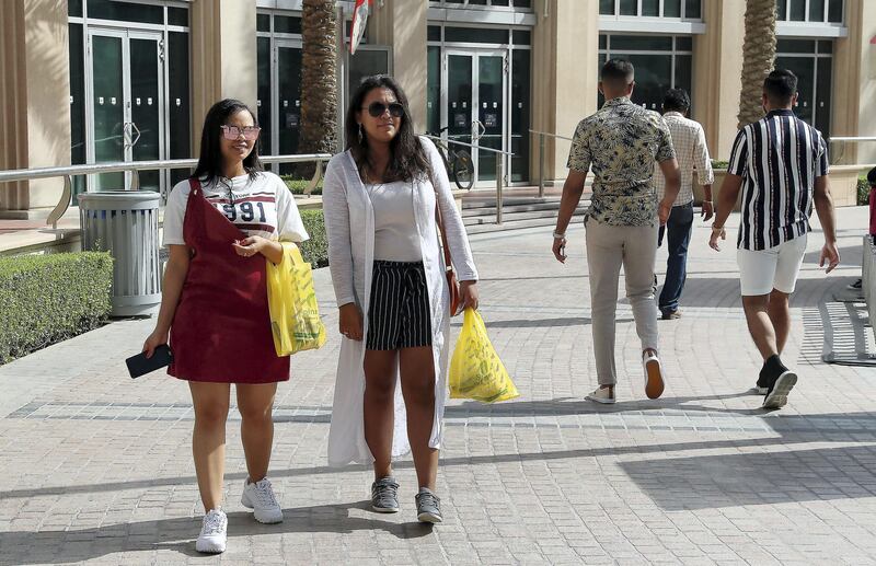 DUBAI , UNITED ARAB EMIRATES , April 4 – 2019 :- Left to Right – Winnie Vilander and Chonay Louw holding their plastic bags after doing shopping at the Spinneys  supermarket in Dubai Marina in Dubai. ( Pawan Singh / The National ) For News. Story by Patrick