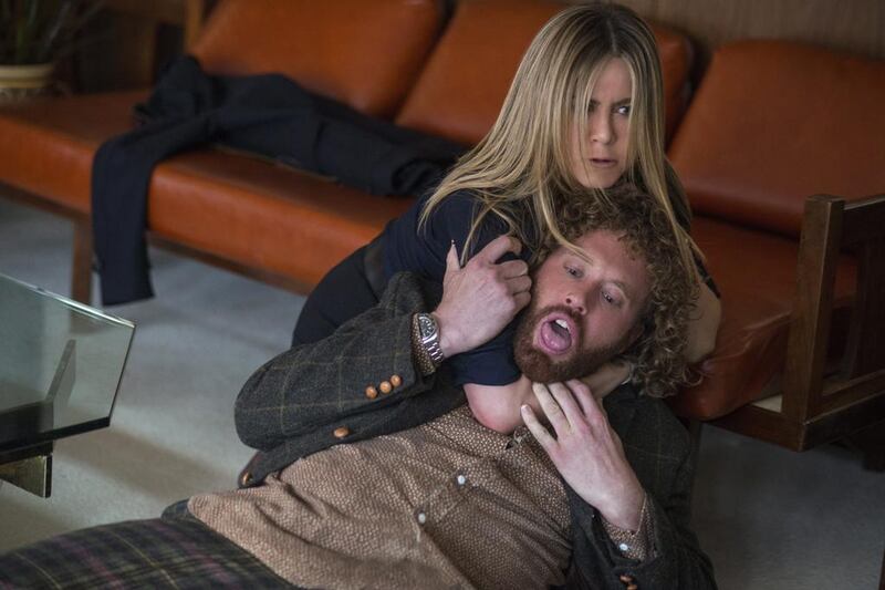 This image released by Paramount Pictures shows Jennifer Aniston and T.J. Miller in a scene from "Office Christmas Party." (Glen Wilson/Paramount Pictures via AP)