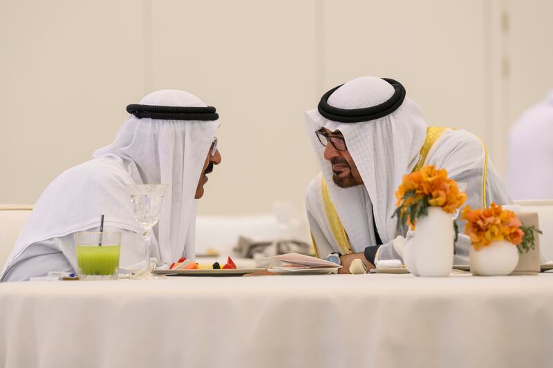 Sheikh Mohamed speaks to Sheikh Meshal over lunch at Qasr Al Watan. Abdulla Al Neyadi / UAE Presidential Court