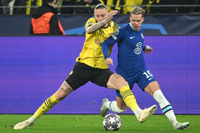 Dortmund midfielder Marius Wolf battles with Mykhailo Mudryk. AFP