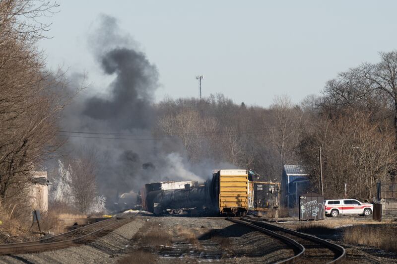 Smoke rises from the derailed cargo train. AFP