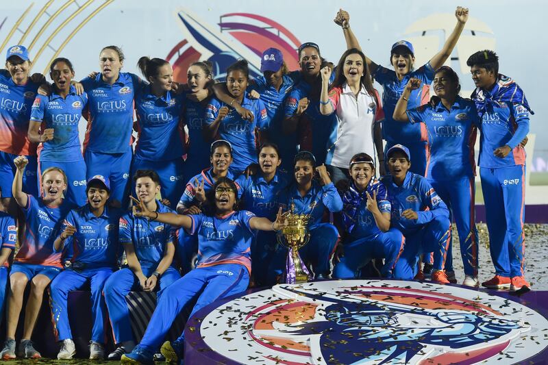 Mumbai Indians with the WPL trophy after their win over Delhi Capitals in the final on Sunday, March 26, 2023. AFP