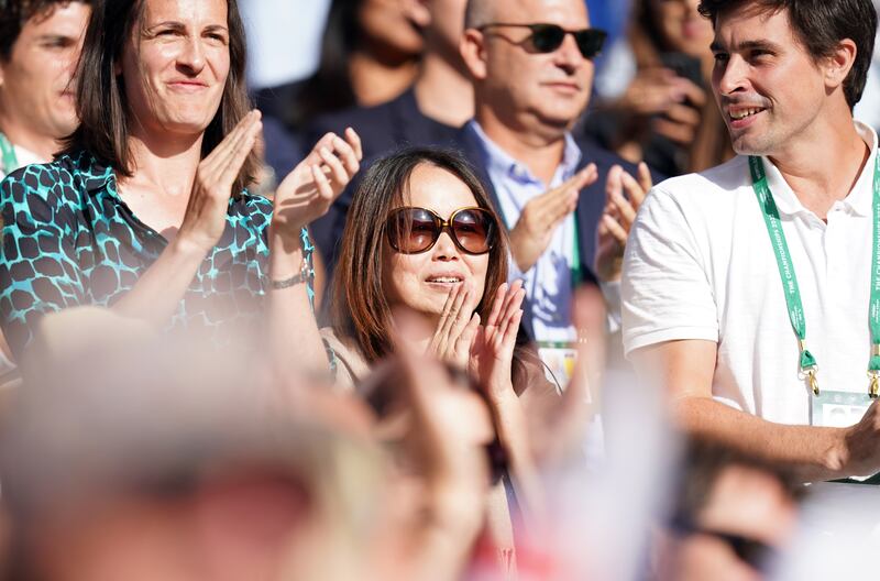 Raducana's mum applauds along with other spectators. PA