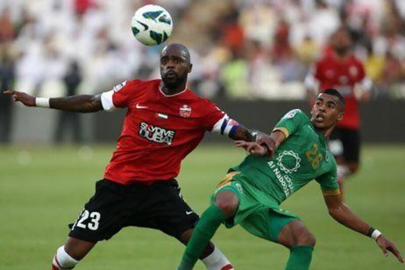 Grafite, left, forces Hassan Ibrahim of Al Shabab off the ball in the President's Cup. Ibrahim signed an extension to remain with Shabab four more years.