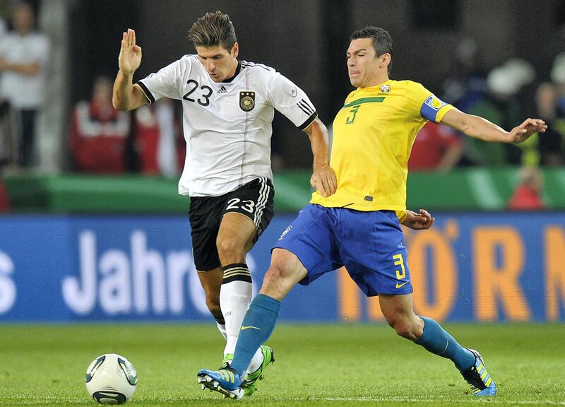 Germany's forward Mario Gomez (L) and Brazil's defender Lucio vie for the ball during the Germany vs Brazil international friendly football match at the Mercedes-Benz Arena in Stuttgart, southern Germany, on August 10, 2011. AFP PHOTO / THOMAS KIENZLE (Photo by THOMAS KIENZLE / AFP)