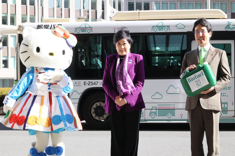 Tokyo's governor Yuriko Koike (centre) pictured at the launch of a scheme to power her city's buses with biofuel to reduce emissions earlier this year. Reuters