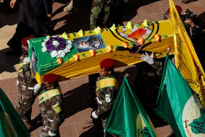 People carry the coffin of Abu Baqir Al Saadi, a commander from Kataib Hezbollah who was killed in a US air strike, during a funeral in Najaf, Iraq. Reuters