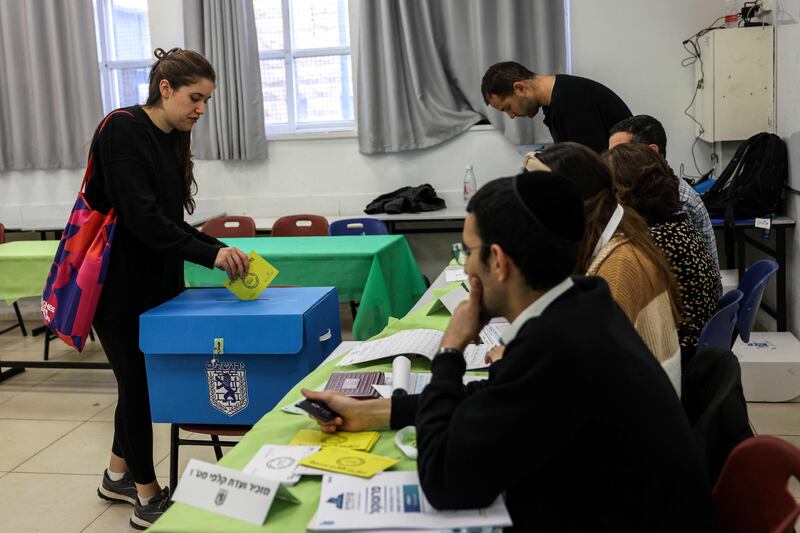 A woman casts her vote in Jerusalem as Israel holds local elections that were postponed twice because of the war in Gaza. AFP