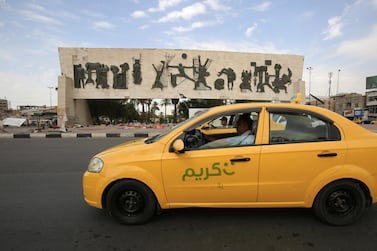 TO GO WITH AFP SPECIAL ABOUT KARIM TAXI (Photo by AHMAD AL-RUBAYE / AFP)