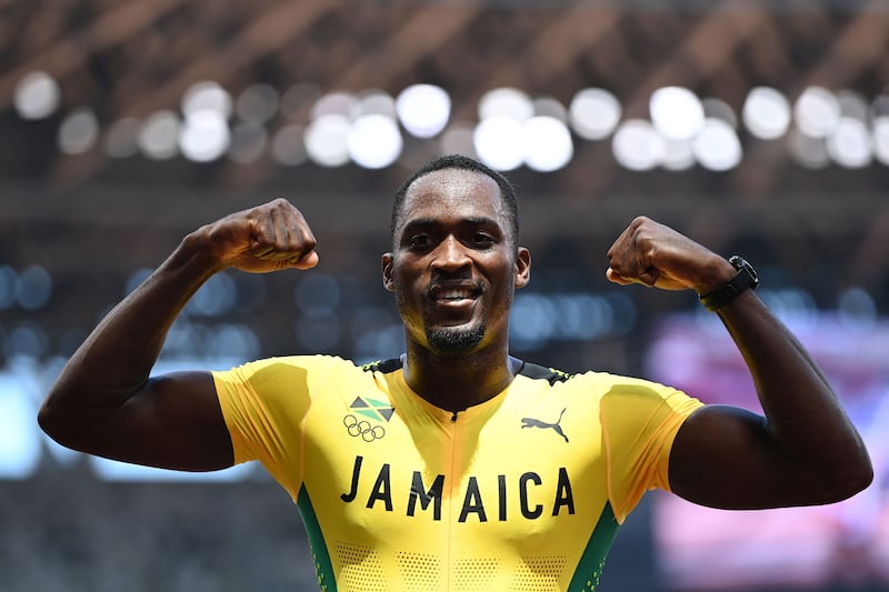 Jamaica's Hansle Parchment celebrates after winning  the men's 110m hurdles final.