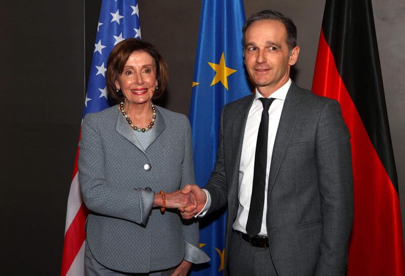 German Foreign Minister Heiko Maas (R) shakes hands with the US' House of Representatives Speaker Nancy Pelosi during a bilateral meeting at the Munich Security Conference in Munich, southern Germany.  AFP