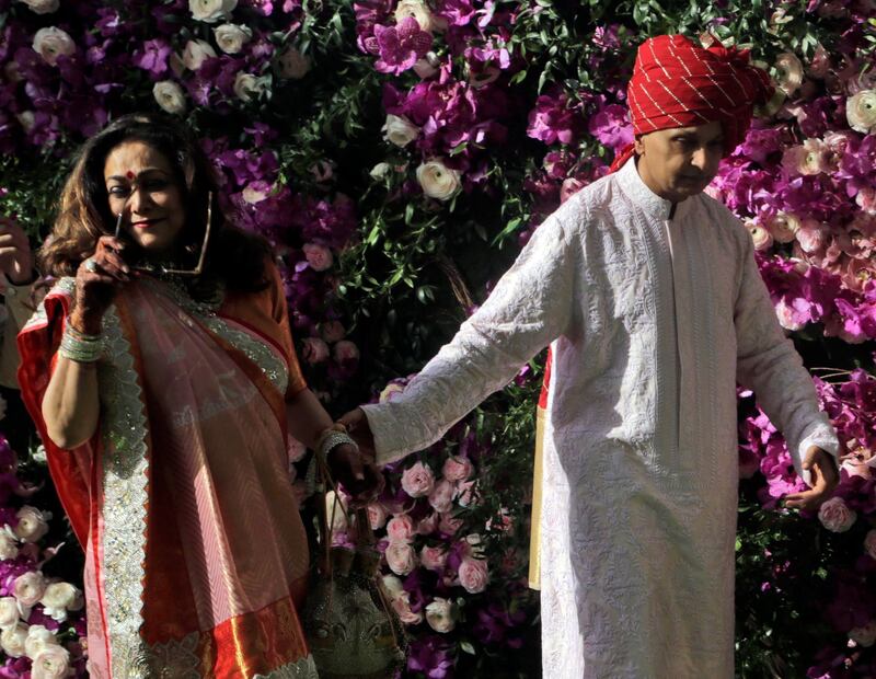 Chairman of Reliance Group Anil Ambani and his wife Tina Ambani arrive for the wedding of Akash Ambani, son of Reliance Industries Chairman Mukesh Ambani, in Mumbai, India, Saturday, March 9, 2019. Photo: AP