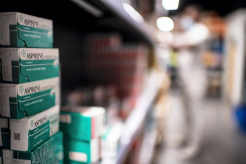 A picture shows aspirine boxes in the biggest French pharmacy in Paris, on September 8, 2020. (Photo by Martin BUREAU / AFP)