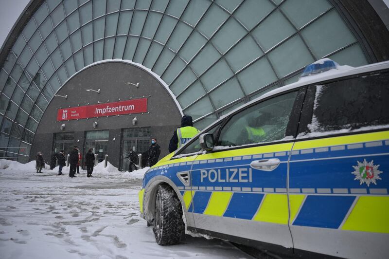 BIELEFELD, GERMANY - FEBRUARY 08: A police car stands in front of the just-opened vaccine center during the second wave of the coronavirus pandemic on February 08, 2021 in Bielefeld, Germany. The 53 vaccine centers across North Rhine-Westphalia are opening their doors today to administer vaccines, mostly for people over 80 years old. Germany has experienced a hampered vaccine rollout due to production setbacks for all three of the vaccine so far approved in the European Union. (Photo by Thomas F. Starke/Getty Images)