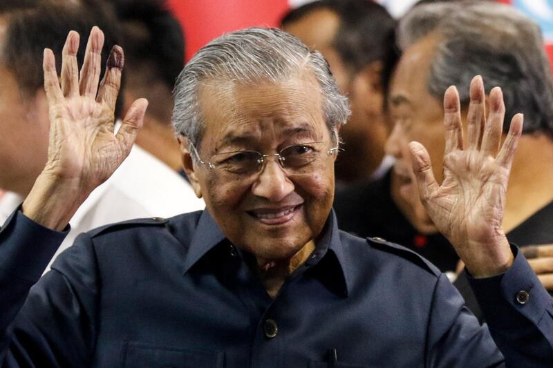 epa06729843 Malaysian Prime Minister Mahathir Mohamad gestures to the media at the end of a press conference in Kuala Lumpur, Malaysia, 12 May 2018. Malaysia's newly elected Prime Minister Mahathir Mohamad has named three new senior ministers in his cabinet after he won a historic election victory on 09 May.  EPA/AHMAD YUSNI